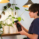 Teenage boy watering indoor plants at home, sustainable lifestyle and indoor gardening Teenage boy watering indoor plants at home, sustainable lifestyle and indoor gardening - PhotoDune Item for Sale