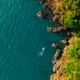 Beautiful golden light over the coast of Ko Chang island at sunrise. Tropical beach aerial view. Beautiful golden light over the coast of Ko Chang island at sunrise. Tropical beach aerial view. - PhotoDune Item for Sale