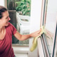 Young smiling women cleaning the windows Young smiling women cleaning the windows - PhotoDune Item for Sale