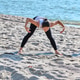 Young woman practicing yoga stretch on sunny Baltic Sea beach Young woman practicing yoga stretch on sunny Baltic Sea beach - PhotoDune Item for Sale