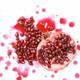 Sliced pomegranate with seeds and juice on white background Sliced pomegranate with seeds and juice on white background - PhotoDune Item for Sale