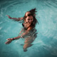 Young Woman Swimming Young Woman Swimming - PhotoDune Item for Sale
