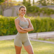A Confident Fitness Model is Posing Outdoors in Stylish and Comfortable Activewear Attire A Confident Fitness Model is Posing Outdoors in Stylish and Comfortable Activewear Attire - PhotoDune Item for Sale