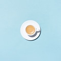 A Cup of Coffee on Blue Background. A Cup of Coffee on Blue Background. - PhotoDune Item for Sale