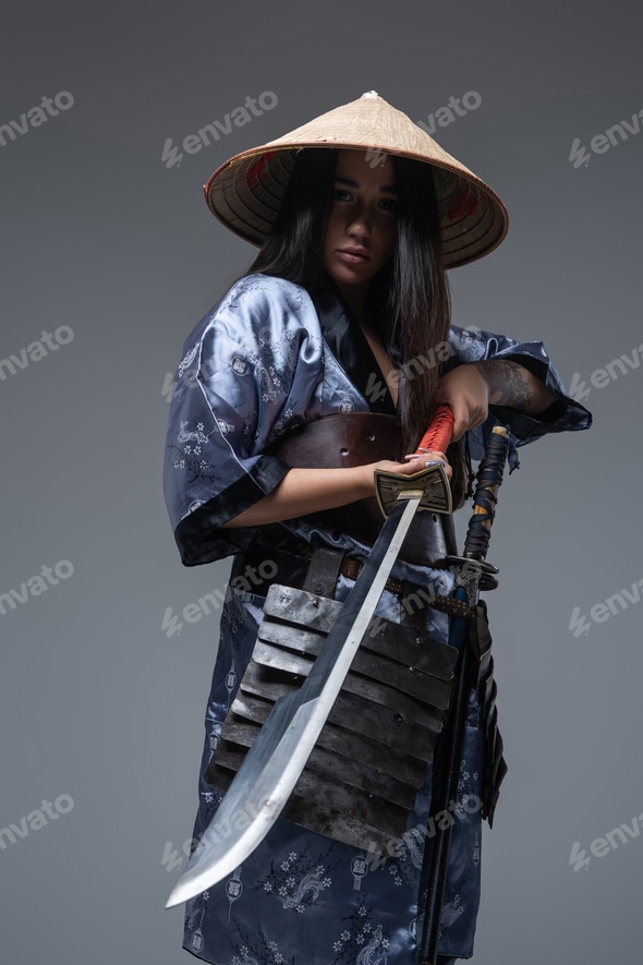 Female samurai with sword and bamboo hat Stock Photo by fxquadro