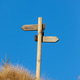 Wooden signpost and blue sky. Copy space on the top. Wooden signpost and blue sky. Copy space on the top. - PhotoDune Item for Sale