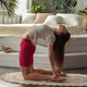 A young woman is doing yoga exercise in a cozy home interior, healthy lifestyle. A young woman is doing yoga exercise in a cozy home interior, healthy lifestyle. - PhotoDune Item for Sale