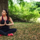 Peaceful Young Woman Meditating In Lotus Pose Under Big Tree Near Lake Peaceful Young Woman Meditating In Lotus Pose Under Big Tree Near Lake - PhotoDune Item for Sale