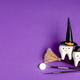dental concept. tooth figurine in halloween costume and dental tools. pumpkins and a broom.on a purp dental concept. tooth figurine in halloween costume and dental tools. pumpkins and a broom.on a purp - PhotoDune Item for Sale