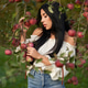 Thoughtful young woman posing in apple orchard. Thoughtful young woman posing in apple orchard. - PhotoDune Item for Sale