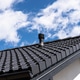 Building roof showing ventilation pipe on black tiles Building roof showing ventilation pipe on black tiles - PhotoDune Item for Sale