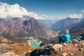 Sitting woman against beautiful lake and mountains Sitting woman against beautiful lake and mountains - PhotoDune Item for Sale