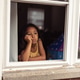 diverse child at home looking out window, lonely bored and sad diverse child at home looking out window, lonely bored and sad - PhotoDune Item for Sale