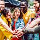 Young diverse friends stacking hands on positive union mood Young diverse friends stacking hands on positive union mood - PhotoDune Item for Sale