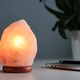Himalayan salt lamp and green houseplant on white working desk Himalayan salt lamp and green houseplant on white working desk - PhotoDune Item for Sale
