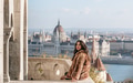 Portrait of beautiful young woman on balcony overlooking Hungarian Parliament in Budapest, Hungary Portrait of beautiful young woman on balcony overlooking Hungarian Parliament in Budapest, Hungary - PhotoDune Item for Sale
