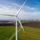 Aerial View of Wind Turbines in Green Field for Renewable Energy Aerial View of Wind Turbines in Green Field for Renewable Energy - PhotoDune Item for Sale
