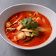 Tasty asian soup with shrimps and vegetables served on plate. Tasty asian soup with shrimps and vegetables served on plate. - PhotoDune Item for Sale