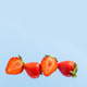 Cut into pieces and whole strawberries in a row. Delicious and healthy food Cut into pieces and whole strawberries in a row. Delicious and healthy food - PhotoDune Item for Sale