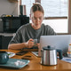 Remote work, Gen Z woman using in cozy kitchen workspace, home office Remote work, Gen Z woman using in cozy kitchen workspace, home office - PhotoDune Item for Sale