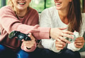 Women playing video game together Women playing video game together - PhotoDune Item for Sale