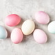 Colorful pastel dyed Easter eggs on light grey background, flat lay. Colorful pastel dyed Easter eggs on light grey background, flat lay. - PhotoDune Item for Sale