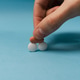 Hand placing pills on top of each other. Hand placing pills on top of each other. - PhotoDune Item for Sale