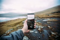 Taking picture with a smartphone on a scenic nordic location Taking picture with a smartphone on a scenic nordic location - PhotoDune Item for Sale