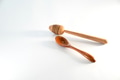 Wooden spoon and honey dipper on white background Wooden spoon and honey dipper on white background - PhotoDune Item for Sale