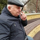 Senior man using nasal spray on a city park bench Senior man using nasal spray on a city park bench - PhotoDune Item for Sale