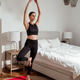 Young fit woman practicing yoga at home in bedroom maintaining balance and mindfulness Young fit woman practicing yoga at home in bedroom maintaining balance and mindfulness - PhotoDune Item for Sale