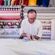 senior man working in atelier cutting curtains. Small business senior man working in atelier cutting curtains. Small business - PhotoDune Item for Sale