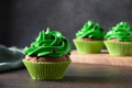 St. Patrick's Day tradinional chocolate cupcakes with green whipped cream and chocolate sprinkles. St. Patrick's Day tradinional chocolate cupcakes with green whipped cream and chocolate sprinkles. - PhotoDune Item for Sale