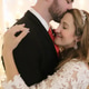Closeup portrait of newly wed couple in a loving embrace as they enjoy their first dance together. Closeup portrait of newly wed couple in a loving embrace as they enjoy their first dance together. - PhotoDune Item for Sale