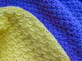 Blue and yellow knitted fabric cotton textured background. Blue and yellow knitted fabric cotton textured background. - PhotoDune Item for Sale