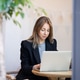 Focused businesswoman project manager typing work information on laptop while working in cafe. Focused businesswoman project manager typing work information on laptop while working in cafe. - PhotoDune Item for Sale
