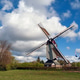White clouds and blue sky above the Oostenwind windmill White clouds and blue sky above the Oostenwind windmill - PhotoDune Item for Sale