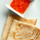 Traditional russian pancakes with red caviar on white plate Traditional russian pancakes with red caviar on white plate - PhotoDune Item for Sale