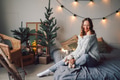 portrait of a beautiful European girl in the light of Christmas garlands, joyful enjoying home comfo portrait of a beautiful European girl in the light of Christmas garlands, joyful enjoying home comfo - PhotoDune Item for Sale