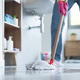 Woman cleaning up the floor with a mop Woman cleaning up the floor with a mop - PhotoDune Item for Sale