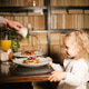 Family mother father and child have Breakfast in the cafe. Nutrition Concept. Family mother father and child have Breakfast in the cafe. Nutrition Concept. - PhotoDune Item for Sale