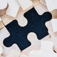 wooden jigsaw puzzle pieces on black background wooden jigsaw puzzle pieces on black background - PhotoDune Item for Sale