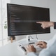 Two programmers looking at computer screen, programmer design custom ...