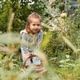 Smiling girl in an orchard standing near basket of apples Smiling girl in an orchard standing near basket of apples - PhotoDune Item for Sale