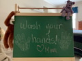 Back to school during pandemic time. “Wash your hands” sign of advice by Mom written on kids room Back to school during pandemic time. “Wash your hands” sign of advice by Mom written on kids room - PhotoDune Item for Sale