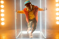Stylish rapper on the stage with illuminated cube Stylish rapper on the stage with illuminated cube - PhotoDune Item for Sale