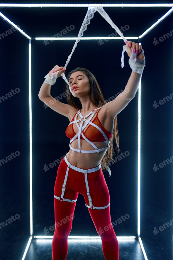 Stripper in bdsm lingerie dancing in luminous cube Stock Photo by NomadSoul1 Stripper in bdsm lingerie dancing in luminous cube Stock Photo by NomadSoul1