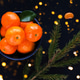 Christmas and New Year concept with Tangerines and lights Christmas and New Year concept with Tangerines and lights - PhotoDune Item for Sale