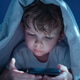 Child using smartphone in bed late at night Child using smartphone in bed late at night - PhotoDune Item for Sale