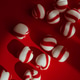 Peppermint candies on red background Peppermint candies on red background - PhotoDune Item for Sale
